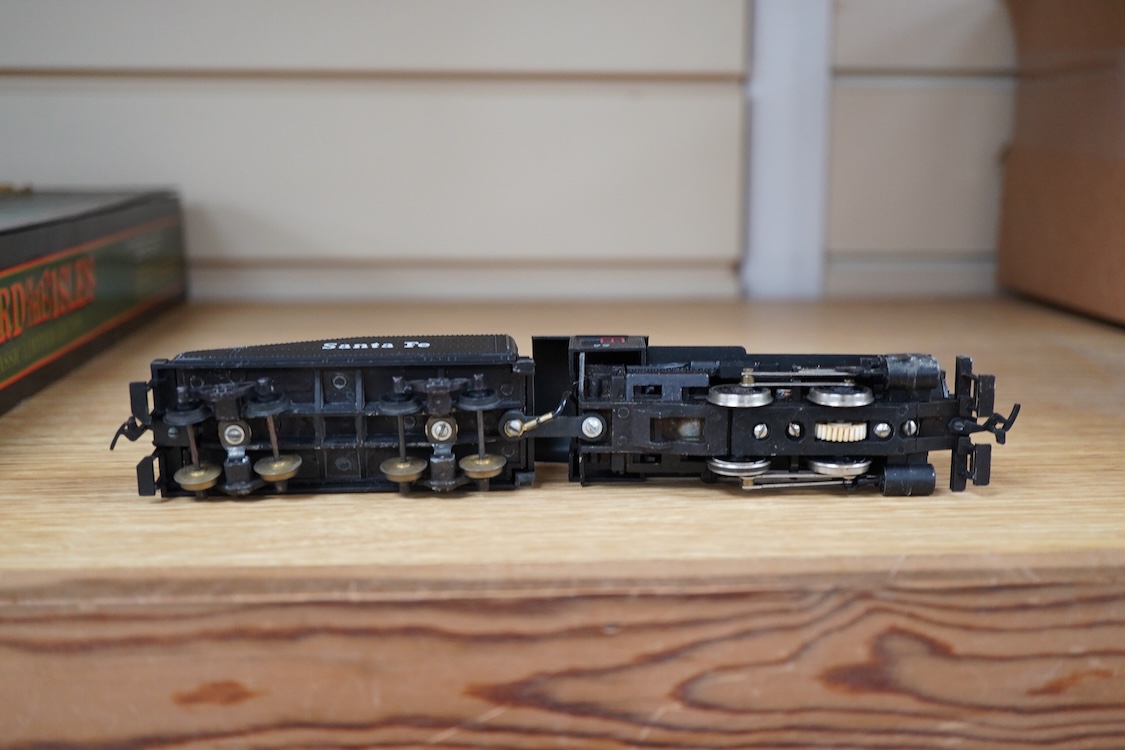 A quantity of US outline HO railway by Athearn, Bachmann, etc. including three locomotives; a Union Pacific Bo-Bo diesel, 1468, a Santa Fe Bo-Bo diesel, 5707, and a Santa Fe 0-4-0 tender engine, together with a 12-wheel